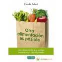 Bolsa de papel con verduras y "Otra alimentación es posible" en español, promoviendo hábitos de compra.