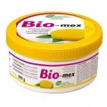 Contenedor redondo de color amarillo de Bio-mex, un limpiador de piedra blanca, sobre un fondo blanco.