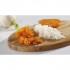 Rallador Combi Chef: Verduras ralladas y zanahoria en rodajas sobre una tabla de madera.