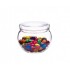Un frasco transparente OPUS Trendglas Jena lleno de coloridos bombones recubiertos de caramelo.