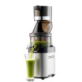 Un exprimidor Kuvings CS600 que vierte zumos verdes en un vaso alto.