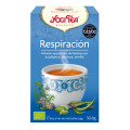 Caja de infusión Yogi Tea “Respiración” con taza y hierbas en el envase.