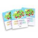Tres libros "Antienvejecimiento con alimentos crudos" con cubiertas vibrantes sobre la dieta de alimentos crudos.