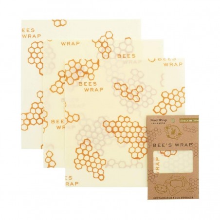 Se exhiben envoltorios de cera de abeja con patrón de panal y empaque ecológico.