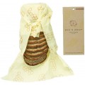 Bee's Wrap solución ecológica cubriendo pan, sin plásticos, con etiqueta al lado.