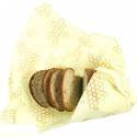 Pan de molde envuelto en papel amarillo reutilizable con un encantador diseño de panal.