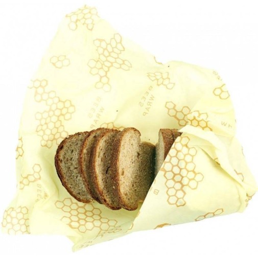 Pan de molde envuelto en cera de abeja amarilla con diseño de panal.