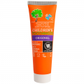 Tubo naranja de URTEKRAM dentífrico natural con logotipos de certificación ecológica para niños.