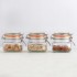 Tres tarros de vidrio clip top redondo 0.5L con terrones de azúcar morena, avena y almendras