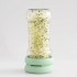 Bote largo de vidrio usando las Tapas germinadoras Sprout Food Huggers para germinar semillas.