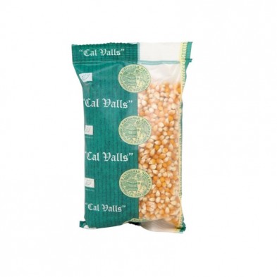 Bolsa de granos de palomitas de maíz Cal Valls con una parte transparente que muestra el contenido.