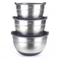Juego de tres cuencos apilados de acero inoxidable apilables, cada uno acompañado de tapas a juego.