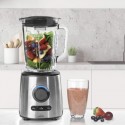 La Batidora Inox Lacor 69581 en una encimera de cocina con frutas en su interior y un batido ya preparado