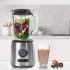 La Batidora Inox Lacor 69581 en una encimera de cocina con frutas en su interior y un batido ya preparado La Batidora Inox Lacor 69581 en una encimera de cocina con frutas en su interior y un batido ya preparado