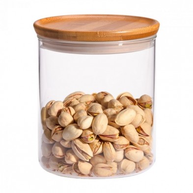 Tarro de vidrio de borosilicato con tapa de bambú mediano trendglas Jena con pistachos en su interior