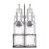 Dos botellas de vidrio transparente con picos vertedores en un soporte de metal negro de la marca KILNER
