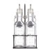 Dos botellas de vidrio transparente con picos vertedores en un soporte de metal negro de la marca KILNER