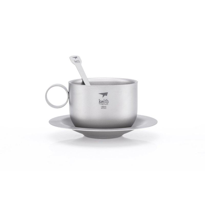 Taza de plata con asa, cuchara a juego y platillo, todo ello con la marca Keith Titanium
